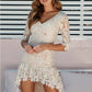 Lace-paneled lace swallowtail dress